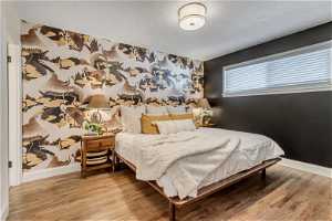 Main bedroom features Milton & King designer wallpaper and easily fits king bed
