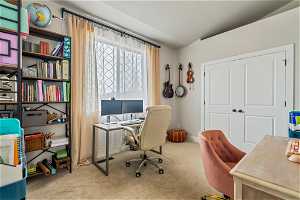 View of carpeted office/bedroom