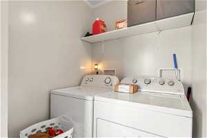 Clothes washing area with hookup for a washing machine, washer and dryer, and crown molding