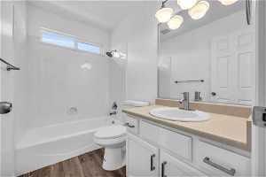 Level 2 Bathroom. Full bathroom featuring vanity, hardwood / wood-style floors, bathtub / shower combination, and toilet