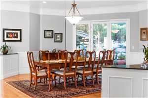 FORMAL DINING ROOM FEATURING CROWN MOLDING AND ACCESS TO BACKYARD PATIO.