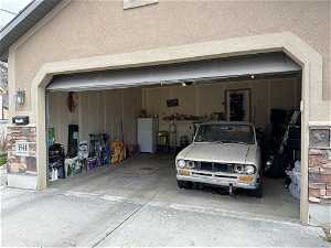 Garage with white refrigerator