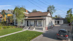 Exterior - Showing entrance to units 1 & 2. Parking shown. One designated space per unit