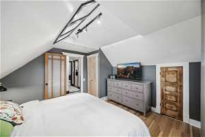 Bedroom 1, Lofted Ceiling, Skylights, Track Lighting, Spacious Storage Closet, Custom Clothes Closet Door, Custom Trim, Wood Floors, Custom Trim