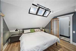Bedroom 1, Lofted Ceiling w/ Skylights, Track Lighting, Wood Blinds, Wood Floor, Custom Trim