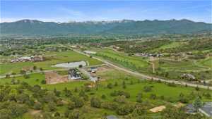 Aerial view from top of hill east of Lot 3 featuring Red Ledges and mountainous views