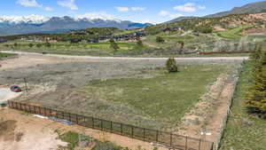 View of lot  from southeast corner featuring Red Ledges in back of lot