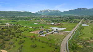 Aerial view from top of hill east of Lot 3 featuring water and mountainous views