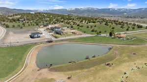 Birds eye view west of neighborhood with water and mountainous views