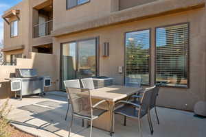 View of patio / terrace featuring area for grilling and a balcony