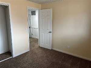 Bedroom 2, view of closet, new carpet, textured ceiling