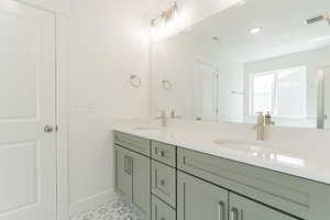 Bathroom featuring vanity and tile patterned floors