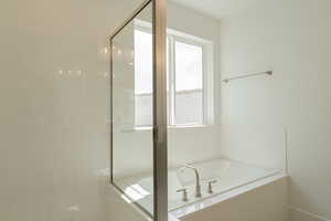 Bathroom with plus walk in shower