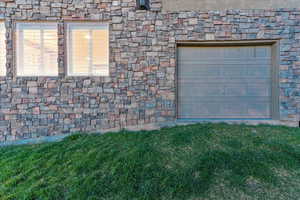 Garage featuring a yard