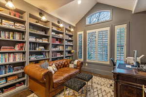 Office with engineered hardwood flooring and vaulted ceiling