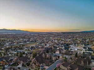 Aerial view at dusk featuring a mountain view