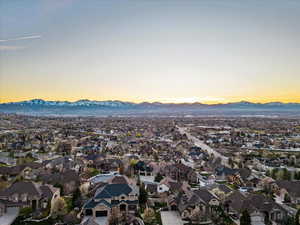 Aerial view at dusk featuring a mountain view