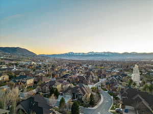 Aerial view at dusk featuring a mountain view