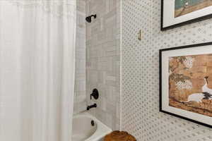 Bathroom featuring shower / bath combo with shower curtain