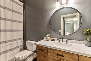 Bathroom featuring toilet and vanity