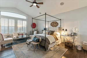 Bedroom featuring vaulted ceiling, engineered hardwood flooring, and ceiling fan