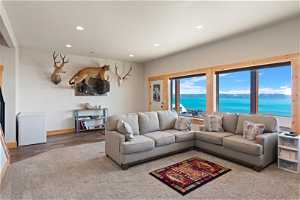 Living room with a water view and LVP and carpet floors