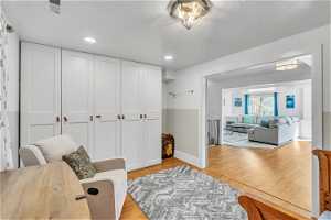 Living area with light hardwood / wood-style flooring