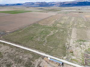 Birds eye view of property with a rural view and a mountain view