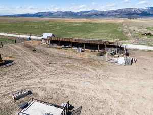 Aerial view featuring a rural view and a mountain view