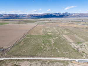 Birds eye view of property featuring a rural view and a mountain view