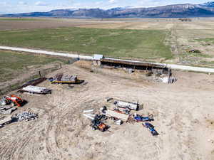 Birds eye view of property featuring a rural view and a mountain view