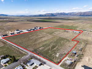 Birds eye view of property featuring a rural view and a mountain view