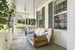 View of patio featuring covered porch