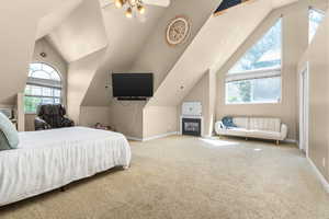 Carpeted bedroom with vaulted ceiling