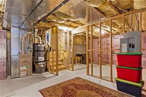 Basement featuring secured water heater