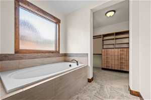 En-suite bath with custom , walk-in closet