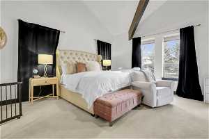 Bedroom featuring beam ceiling, high vaulted ceiling, and light colored carpet