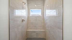 Bathroom featuring a tile shower