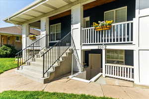 Entrance to property featuring covered porch