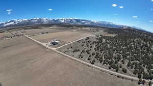 Birds eye view of property with a mountain view