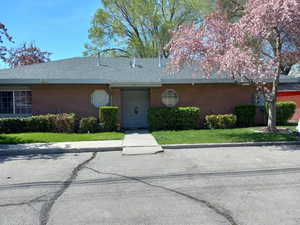 Single story home featuring a front lawn