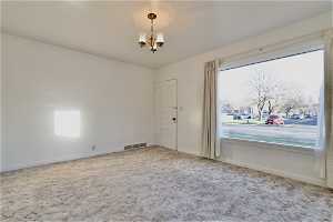Family/living room at front of home. Huge window!