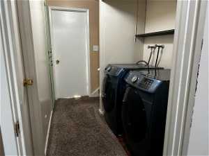 Washroom with independent washer and dryer and dark carpet