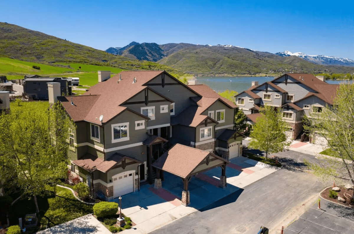 Aerial view featuring a water and mountain view