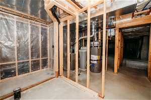 Basement featuring water heater and bathroom
