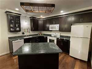 KITCHEN WITH DARK CABINETS, ISLAND, AND POT RACK!!