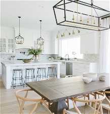 Dining space with light hardwood / wood-style floors