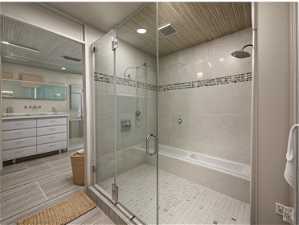 Bathroom with tile floors, plus walk in shower, and vanity