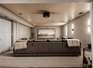 Home theater featuring hardwood / wood-style floors and wood ceiling