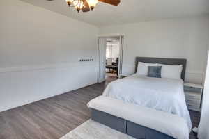 Bedroom featuring dark hardwood / wood-style floors and ceiling fan